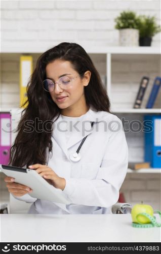 medium shot young doctor with tablet