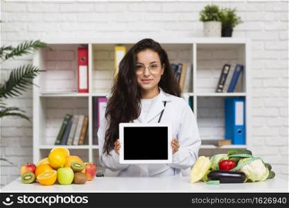 medium shot young doctor with tablet mock up