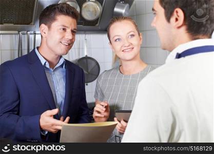Meeting Of Restaurant Team In Kitchen