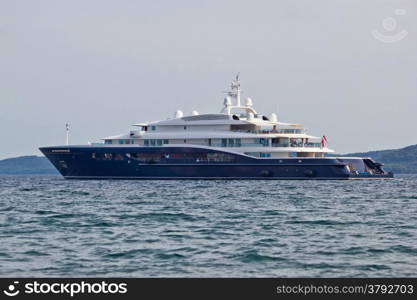 Megayacht floating on open sea, side view