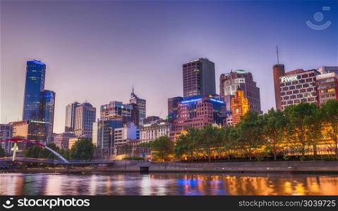MELBOURNE - OCTOBER 2015: Beautiful city skyline over Yarra rive. MELBOURNE - OCTOBER 2015: Beautiful city skyline over Yarra river at night. The city attracts 10 million tourists annually.