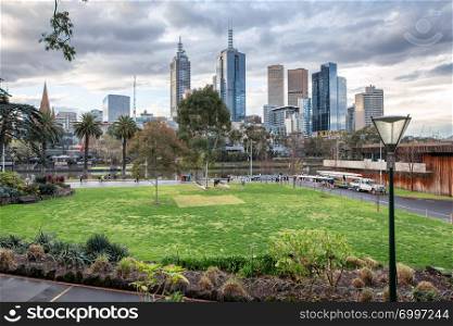 Melbourne skyline on a cloudy afternoon from Alexandra Gardens, Australia.