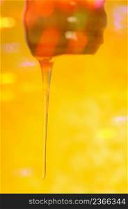 Melted caramel dripping. Pouring stream of caramel sauce. Hot sweet liquid syrup. liquid caramel. Dripping golden syrup