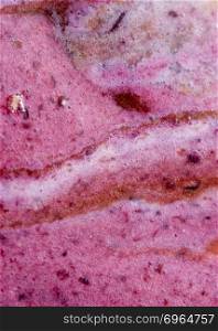 Melted fruits ice cream is a abstractive decorate background of pink and brown color. Close-up, top view. Summer concept.. Structure of melting chocolate and fruits ice cream. Creative background close-up.
