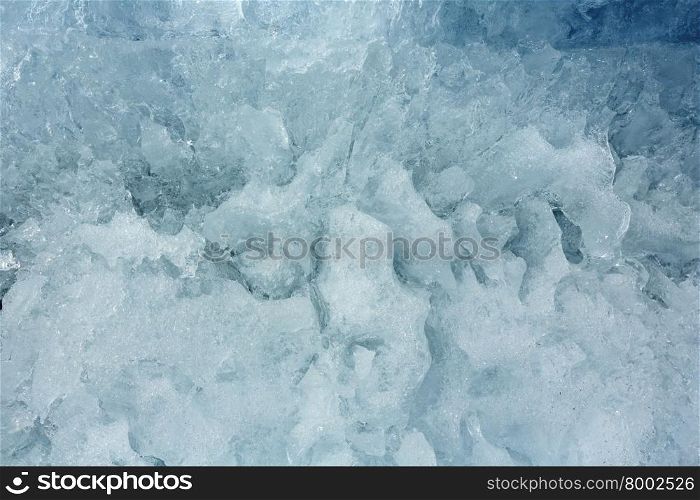 Melting glacial block of ice closeup.