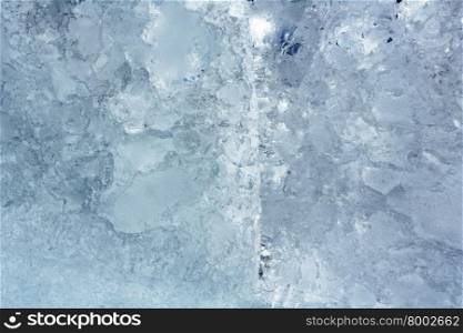 Melting glacial block of ice closeup.