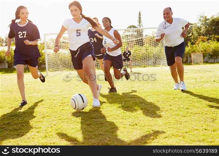 Members Of Female High School Soccer Playing Match