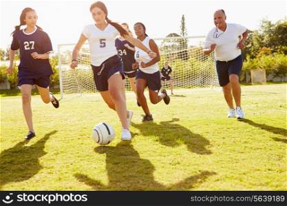 Members Of Female High School Soccer Playing Match