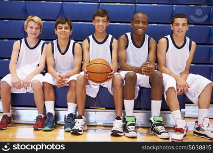 Members Of Male High School Basketball Team On Bench