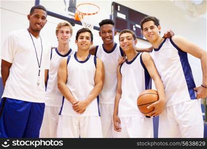 Members Of Male High School Basketball Team With Coach