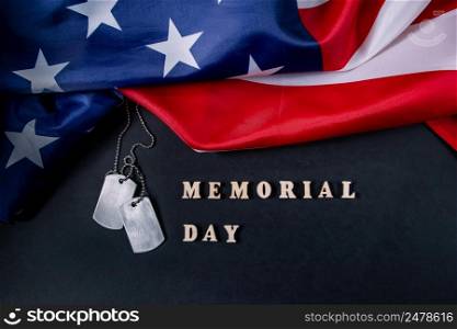 Memorial day concept. American flag and military dog tags on a black background. Remember and honor.. Memorial day concept. American flag and military dog tags on black background. Remember and honor.