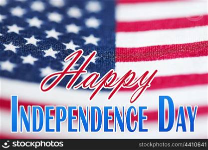 memorial day, patriotism and holiday concept - happy independence day words over american flag background