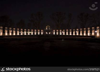 Memorial lit up at night, World War II, Washington DC, USA