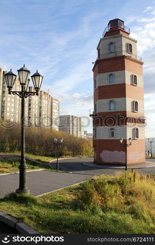 Memorial red brick light tower on the hill in Murmansk, Russia