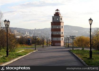 Memorial red brick light tower on the hill in Murmansk, Russia