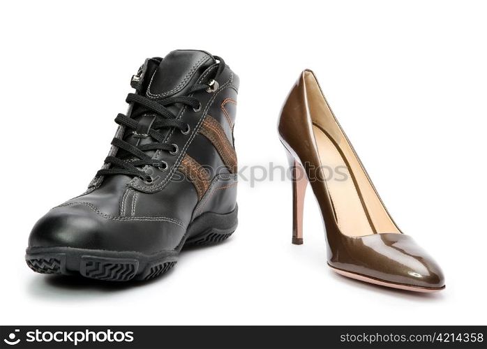 Men&acute;s boots and elegant female shoes on white background