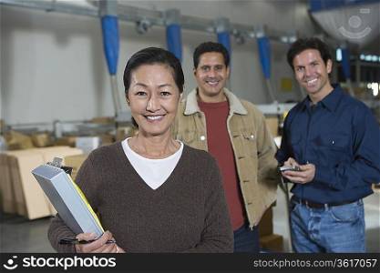 Men and woman in distribution warehouse Portrait