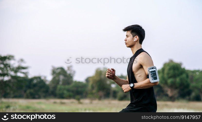 Men and women exercise by running on the road.