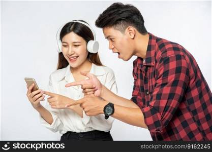 Men and women love listening to music on their smartphones.