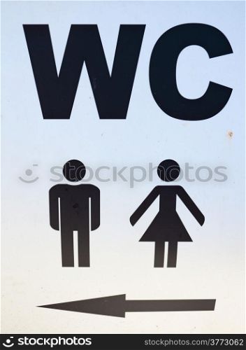 Men and women sign of public toilets with an arrow showing direction WC restroom