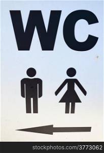 Men and women sign of public toilets with an arrow showing direction WC restroom