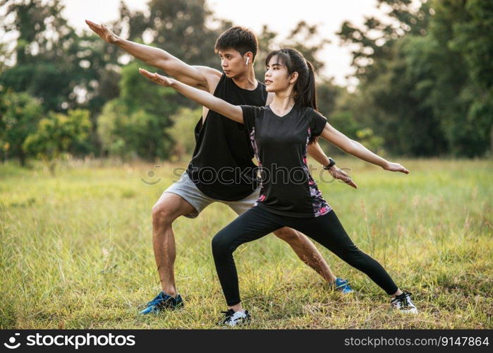 Men and women warm up before and after exercising. Selective focus.