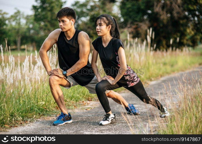 Men and women warm up before and after exercising. Selective focus.