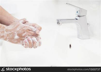 Men are washing their hands every time before eating to prevent germs, viruses, covid-19 and bacteria.