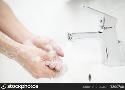 Men are washing their hands every time before eating to prevent germs, viruses, covid-19 and bacteria.