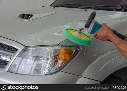 Men are working car paint polishing.