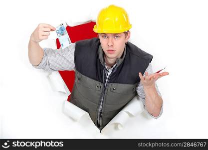 Men coming out of hole paper ticket in hand