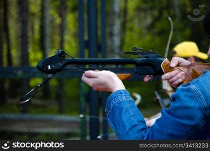Men crossbow shooting