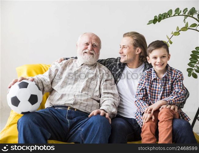 men different generations sitting couch