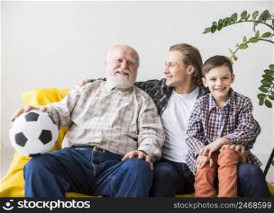men different generations sitting couch