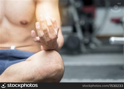 Men doing yoga meditation lotus pose after workout in gym for cool down muscle and relax feeling so strong and happiness,Recreation Concept