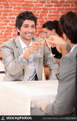 Men drinking champagne