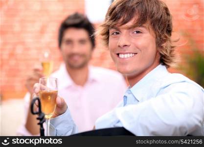 Men drinking champagne in a restaurant