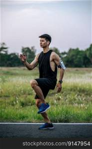 Men exercise by running and lifting their knees forward.