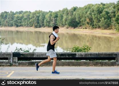 Men exercise by running on the road on the bridge.