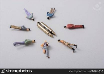 Men figurine around Bullet as Conceptual against the war photography