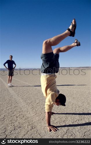 Men Goofing Around in Desert