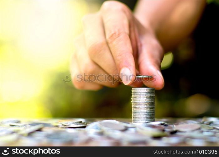 Men hand are sorted coins.