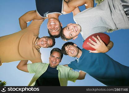 Men in a Football Huddle