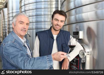 Men in a winemaking facility