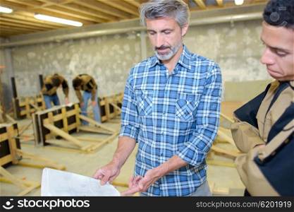 Men in a woodwork class