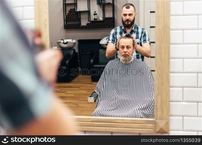 Men in barbershop hair care service