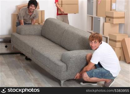 Men lifting sofa