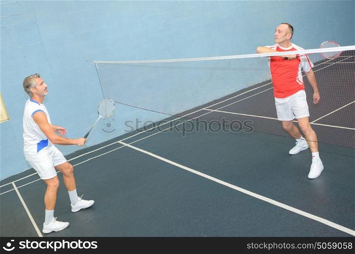 Men playing badminton