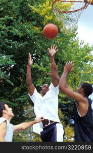 Men Playing Basketball