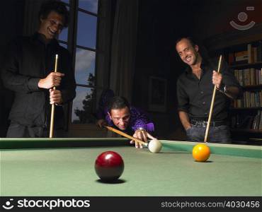 Men playing snooker